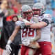 Washington State's Konner Gomes (77) celebrates with De'Zhaun Stribling (88) as he makes a touchdown in the third quarter at the 88th Tony the Tiger Sun Bowl against Central Michigan at Sun Bowl Stadium in El Paso, Texas, on Friday, Dec. 31, 2021.